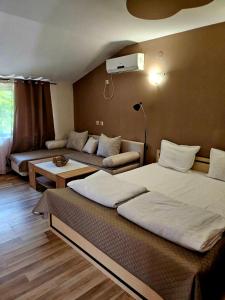 A bed or beds in a room at Orehite-Family Hotel ,Food & Pool