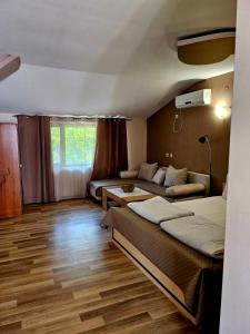 A bed or beds in a room at Orehite-Family Hotel ,Food & Pool