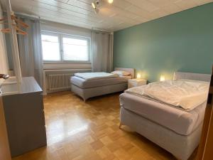 Postel nebo postele na pokoji v ubytování Ferienwohnung mit Balkon