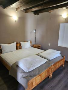 A bed or beds in a room at Orehite-Family Hotel ,Food & Pool