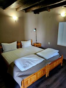 A bed or beds in a room at Orehite-Family Hotel ,Food & Pool
