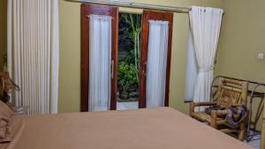 Postel nebo postele na pokoji v ubytování Three V Homestay