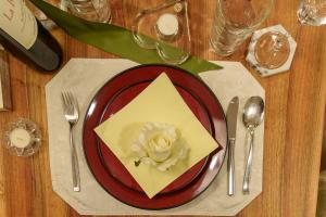 a plate with a flower on top of a table at Villa Musica in Lenzburg
