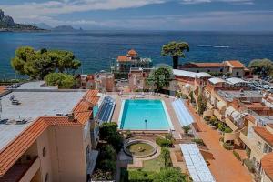an aerial view of a building with a swimming pool at Ashur 163 - Mondello in Palermo