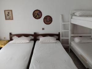 Ένα ή περισσότερα κρεβάτια σε δωμάτιο στο Angela House