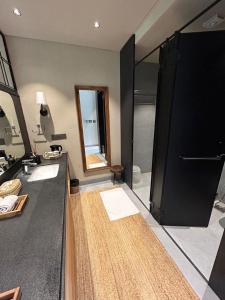 a bathroom with two sinks and a large shower at Soul Nest-Pyramid Valley International Bengaluru in Bangalore
