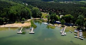 an aerial view of a marina with boats in the water at Lago Apartamenty Domki in Niesulice