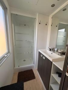 a bathroom with a shower and a sink at A Casa Di l'Altana in Porto-Vecchio