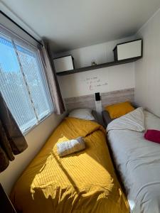 a small room with two beds in it at A Casa Di l'Altana in Porto-Vecchio