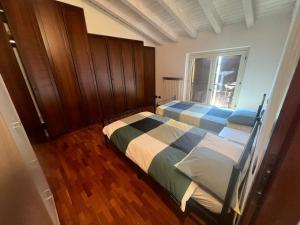 Postel nebo postele na pokoji v ubytování Terrazza su Volta Mantovana
