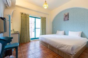 Postel nebo postele na pokoji v ubytování Rainbow B&B