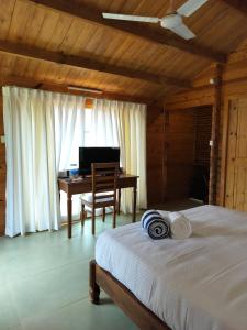 Postel nebo postele na pokoji v ubytování BR cottages + 2 fotografie