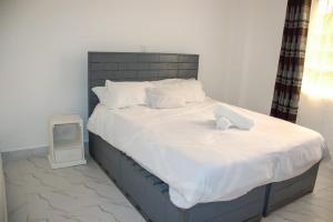Voodi või voodid majutusasutuse One bedroom unit with wi-fi & parking toas