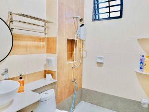 a bathroom with a shower and a toilet and a sink at JB-Bukit Indah 8-15pax Spacious Home! 5min to Aeon in Johor Bahru