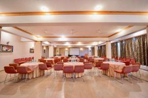 a large room with tables and chairs in it at Nature View Resort !! A Four Star Lavish & Luxury Resort in Chail