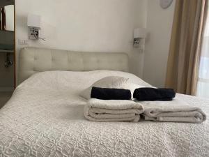 Ένα ή περισσότερα κρεβάτια σε δωμάτιο στο B&B Camera & Caffe