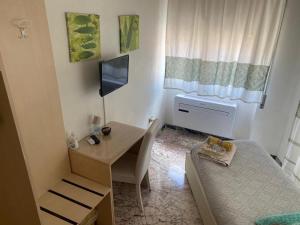 Ένα ή περισσότερα κρεβάτια σε δωμάτιο στο B&B Camera & Caffe