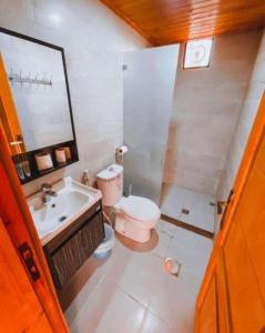 a bathroom with a sink and a toilet and a mirror at Yazan Desert Camp in Wadi Rum +168 photos