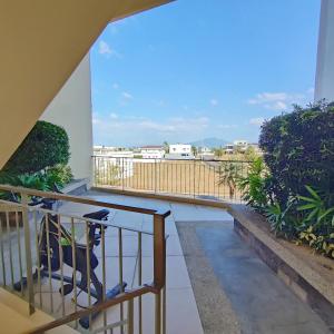 a balcony with a view of a city at Condo in Silang near Nuvali - Dy's Haven Suites in Silang +26 photos