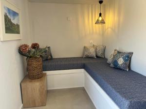 A bed or beds in a room at Ammoudara Bay Villa