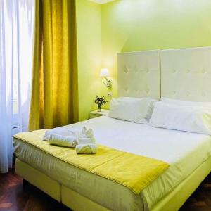 Säng eller sängar i ett rum på Relais Villa Coppedè