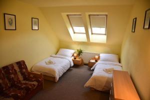 Postel nebo postele na pokoji v ubytování Penzion Na Pastoušce