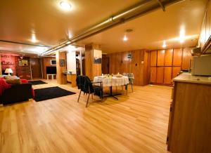 a living room with a table in the middle of a room at Maria Montreal in Montreal +5 photos
