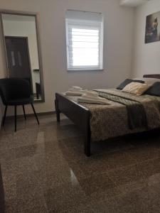 Ένα ή περισσότερα κρεβάτια σε δωμάτιο στο Apartments Amfora Valbandon