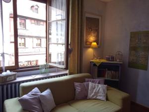 Area soggiorno di Appartements & Chambres Les Loges du Capucin
