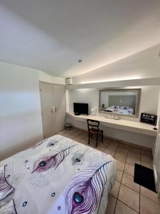 Postel nebo postele na pokoji v ubytování Moulin de la Sambuc