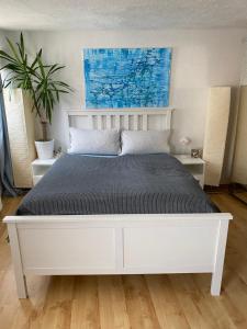 Säng eller sängar i ett rum på Maritimes Gästehaus