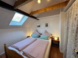 Postel nebo postele na pokoji v ubytování Landhaus up de Warft - Backhaus