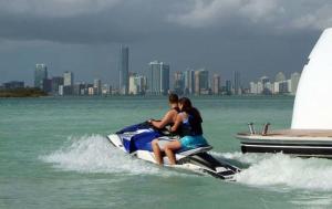 a group of people riding a jet ski on the water at CREW KEY WEST in Antibes