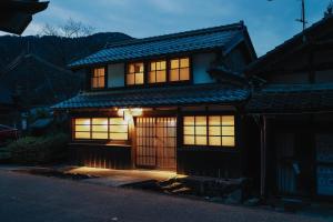a house with its lights on at night at 八百熊川 Yao-Kumagawa in Kumagawa