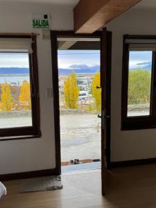 an open door to a room with a view at Mirando al canal in Ushuaia