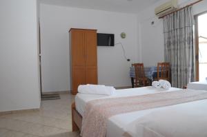 Postel nebo postele na pokoji v ubytování Hola Rooms