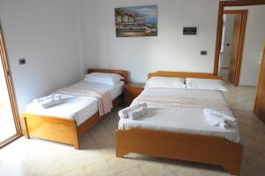 Postel nebo postele na pokoji v ubytování Hola Rooms