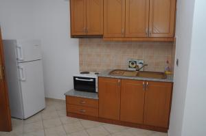 Kuchyň nebo kuchyňský kout v ubytování Hola Rooms