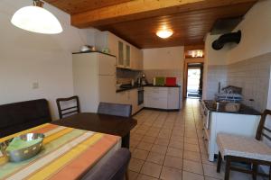 a kitchen and living room with a table and a table sidx sidx sidx at Fewo Turmblick in Oberried