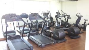 a room with a bunch of treadms and elliptical machines at The Coast in Bangkok