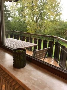 a balcony with a bench and a large window at Fewo Sunneschii, Höchenschwand, Dorf am Himmel, Sauna im Haus in Höchenschwand