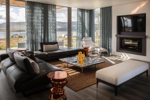 a living room with a couch and a table at Milk and Honey Villa 192 in Hermanus