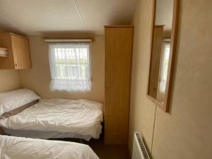 Postel nebo postele na pokoji v ubytování Caravan SK 110