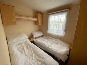 Postel nebo postele na pokoji v ubytování Caravan SK 110