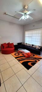a living room with a tiger rug and a couch at ENTIRE LUXURY APARTMENTS in Mbabane