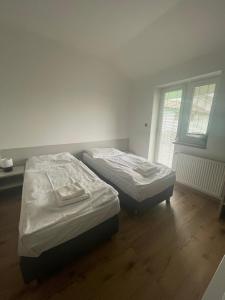Postel nebo postele na pokoji v ubytování HOTEL ZELENÝ DVOR