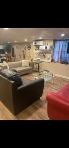 a living room with a couch and a table at PRIVATE ENTRANCE APT RooM #4 in Dallas