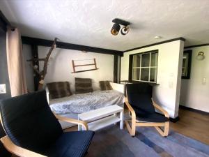 Llit o llits en una habitació de Ferienwohnung Michel 02 im Haus Schwarzwaldmarille- Todtnauberg, Feldberg - b45630