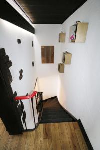 a staircase in a room with white walls and wooden floors at Ferienwohnung Michel 02 im Haus Schwarzwaldmarille- Todtnauberg, Feldberg - b45630 in Todtnau