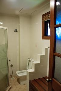 a bathroom with a toilet and a sink at Carpe Diem Orchard Home in Rawang